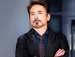 Tony Stark folding his arms and rolling his eyes in a short reaction loop