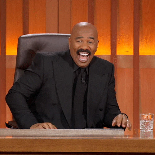 Single person laughing behind a desk GIF template